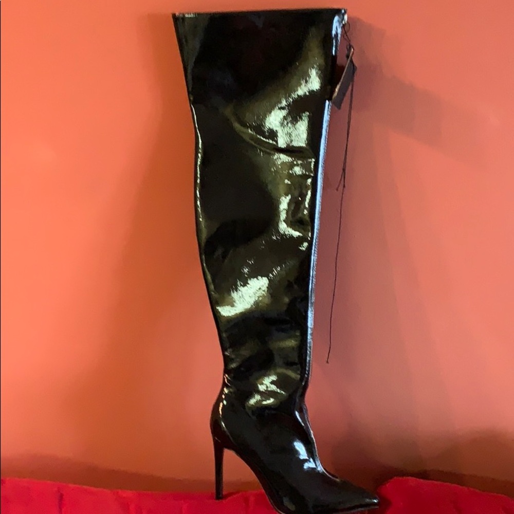 Black thigh high patent leather boot